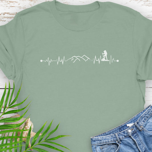 Green t-shirt with a heartbeat line with a mountain range and backpacker.