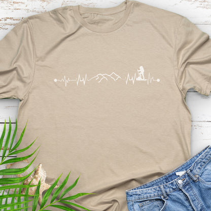 Beige t-shirt with a heartbeat line with a mountain range and backpacker.