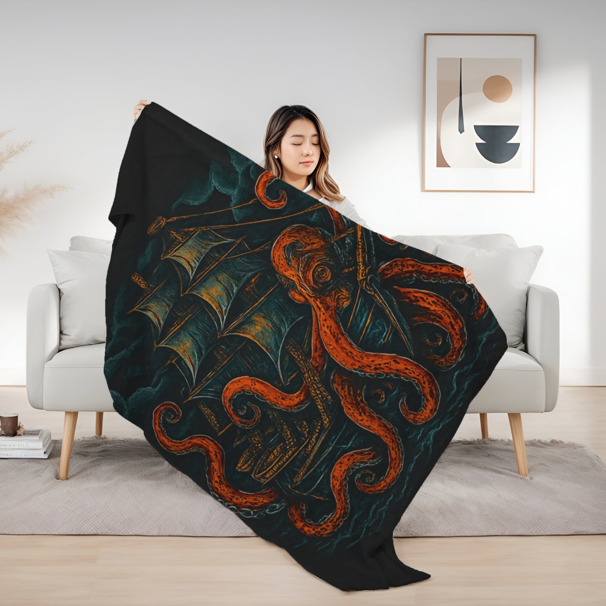 Woman holding a decorative blanket with ship and octopus design in a living room.
