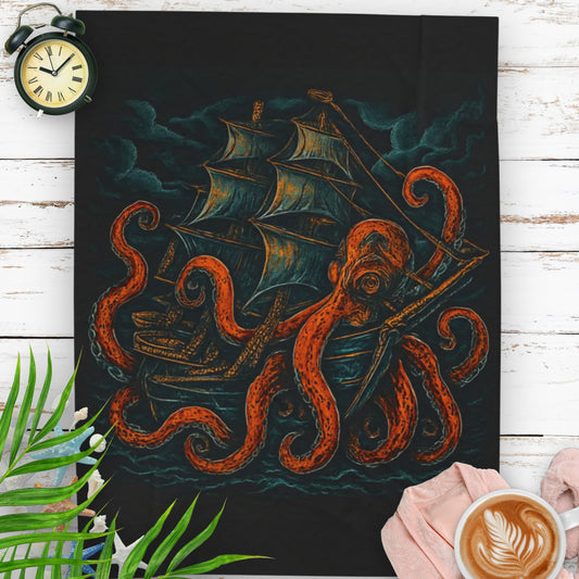 Black velveteen blanket with an octopus enveloping a pirate ship with stormy clouds in the background.