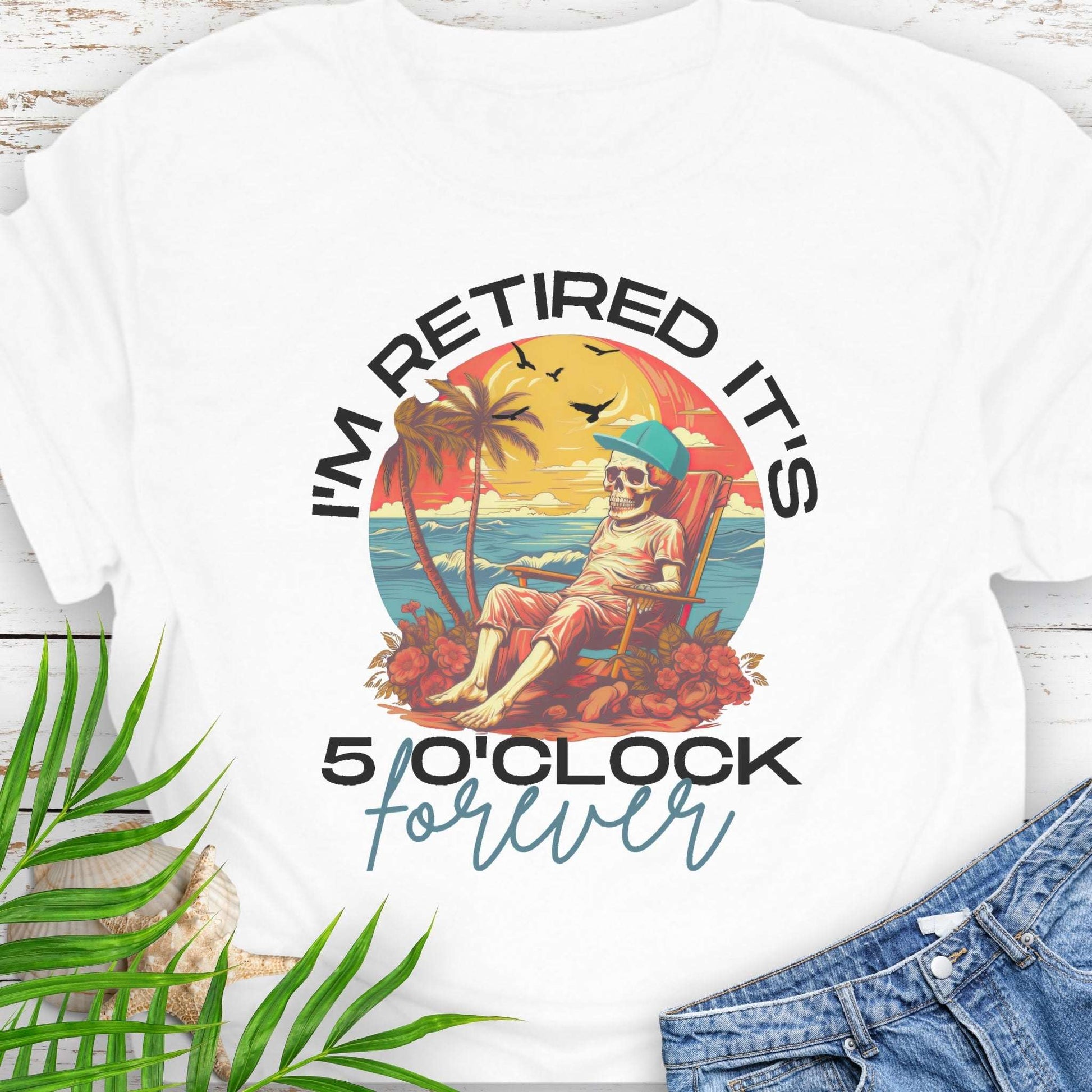 White t-shirt with a skeleton lounging on beach with text 'I'm Retired It's 5 0'Clock Forever.