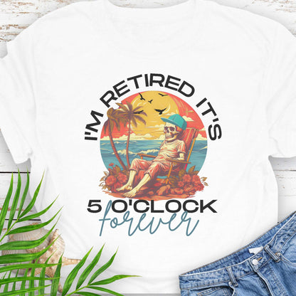 White t-shirt with a skeleton lounging on beach with text 'I'm Retired It's 5 0'Clock Forever.