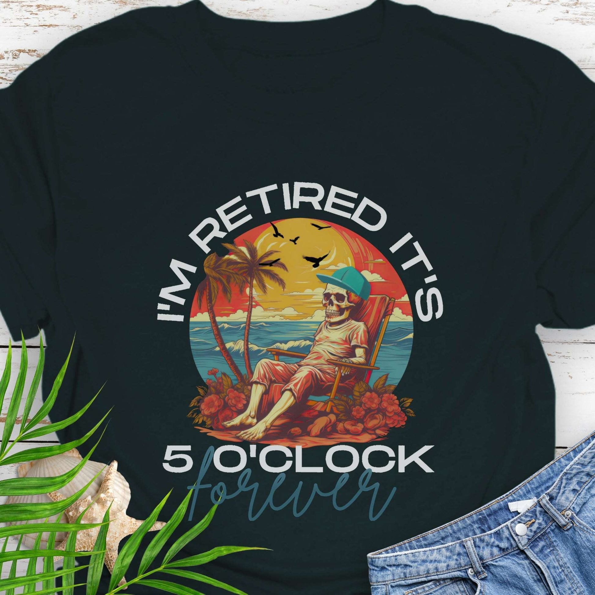 Black t-shirt with a skeleton lounging on beach with text 'I'm Retired It's 5 0'Clock Forever.