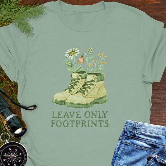 Sage T-shirt with hiking boots and wildflowers that says "Leave Only Footprints."