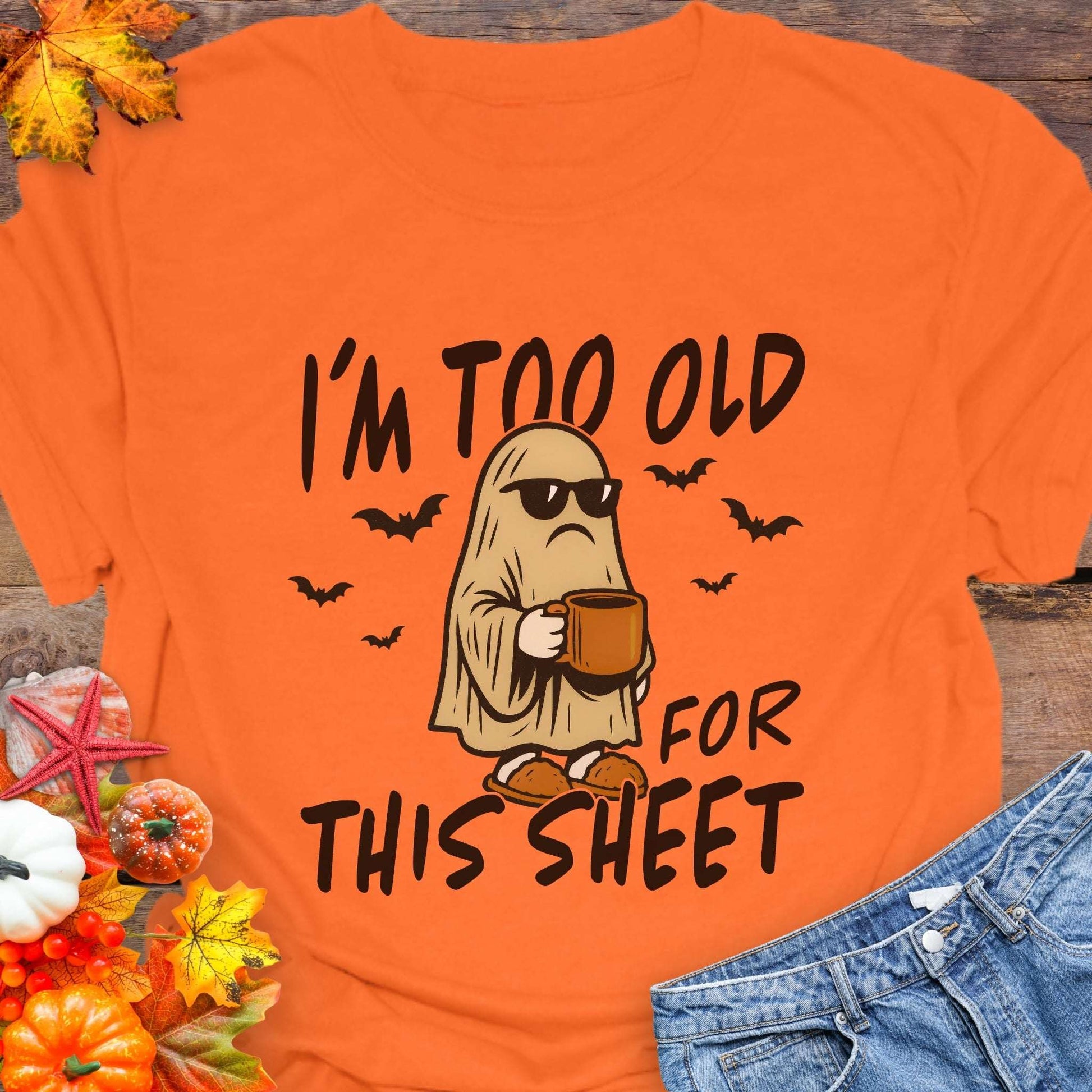 Orange t-shirt with ghost graphic and text 'I'm too old for this sheet'.