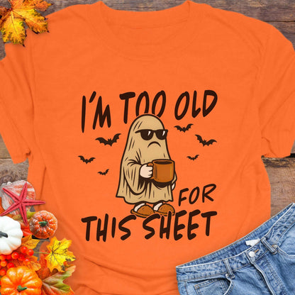 Orange t-shirt with ghost graphic and text 'I'm too old for this sheet'.