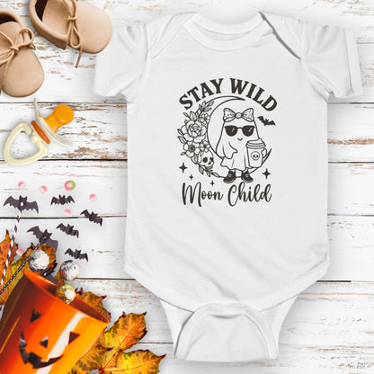 White baby infant bodysuit featuring a girl ghost sitting on a crescent moon with floral accents and a skull design, with the text “Stay Wild Moon Child.”