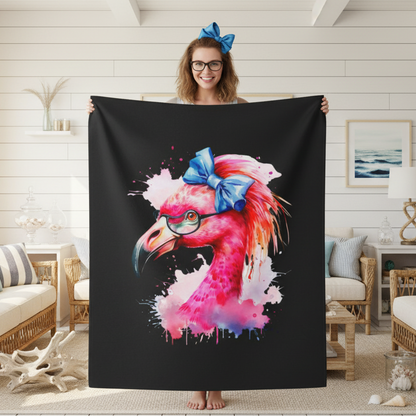 A black blanket with a colorful flamingo head with a big blue bow.