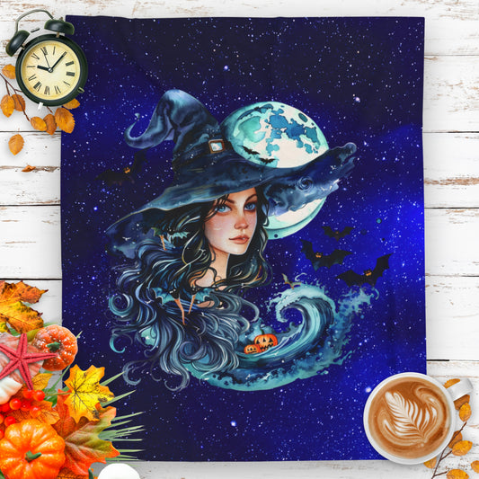 Halloween plush blanket with witch, ocean wave, pumpkins, and full moon in starry sky.