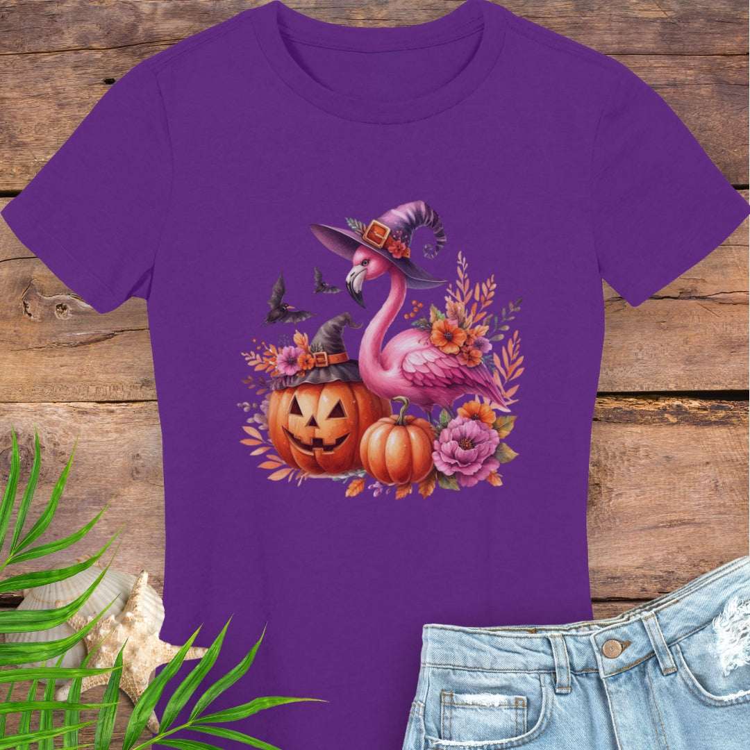 Purple t-shirt with Halloween-themed flamingo design on a wooden surface.