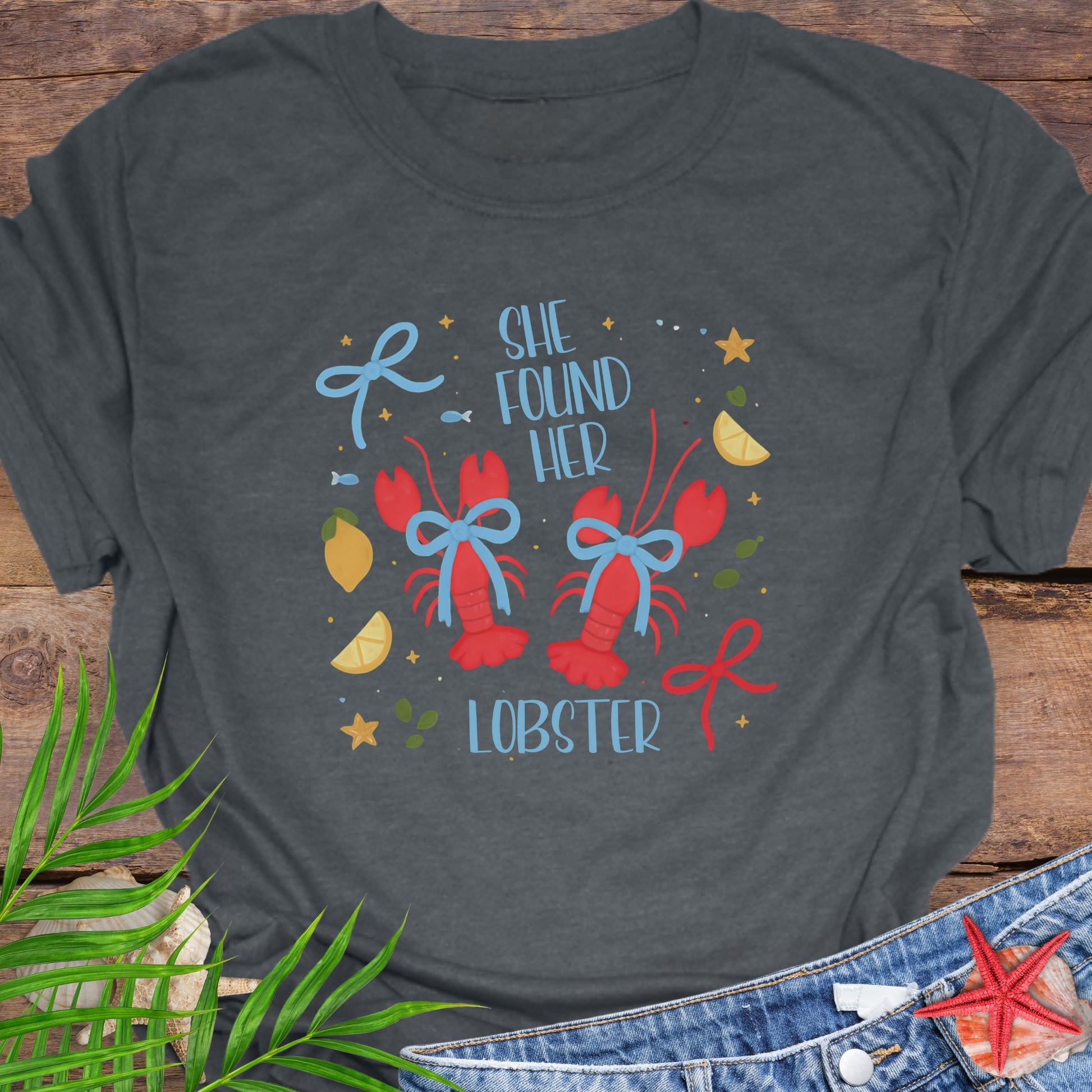 Gray t-shirt with 'She Found Her Lobster' graphic design.