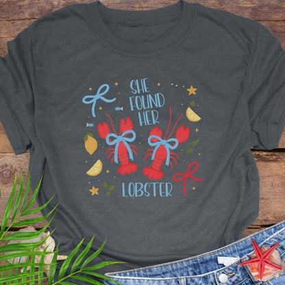 Gray t-shirt with 'She Found Her Lobster' graphic design.