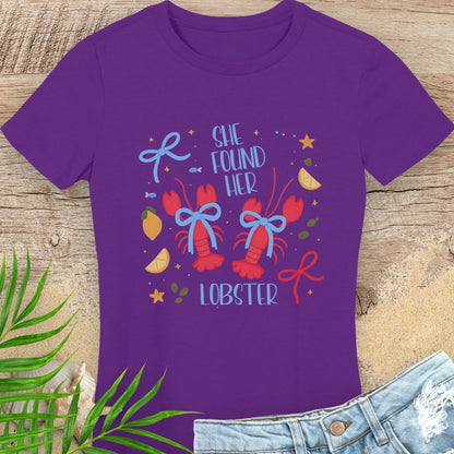 Purple  woman's t-shirt with colorful lobster design and text She Found Her Lobster.