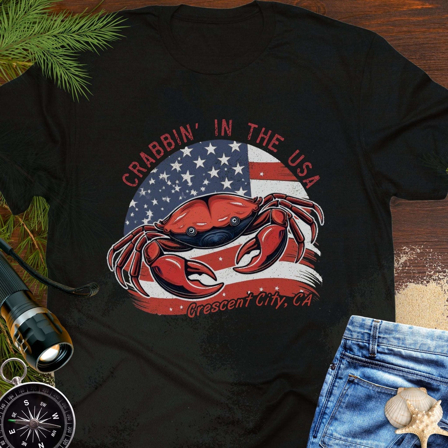 Black t-shirt with a crab and American flag design and text 'Crabbin' in the USA – Crescent City, CA'. 