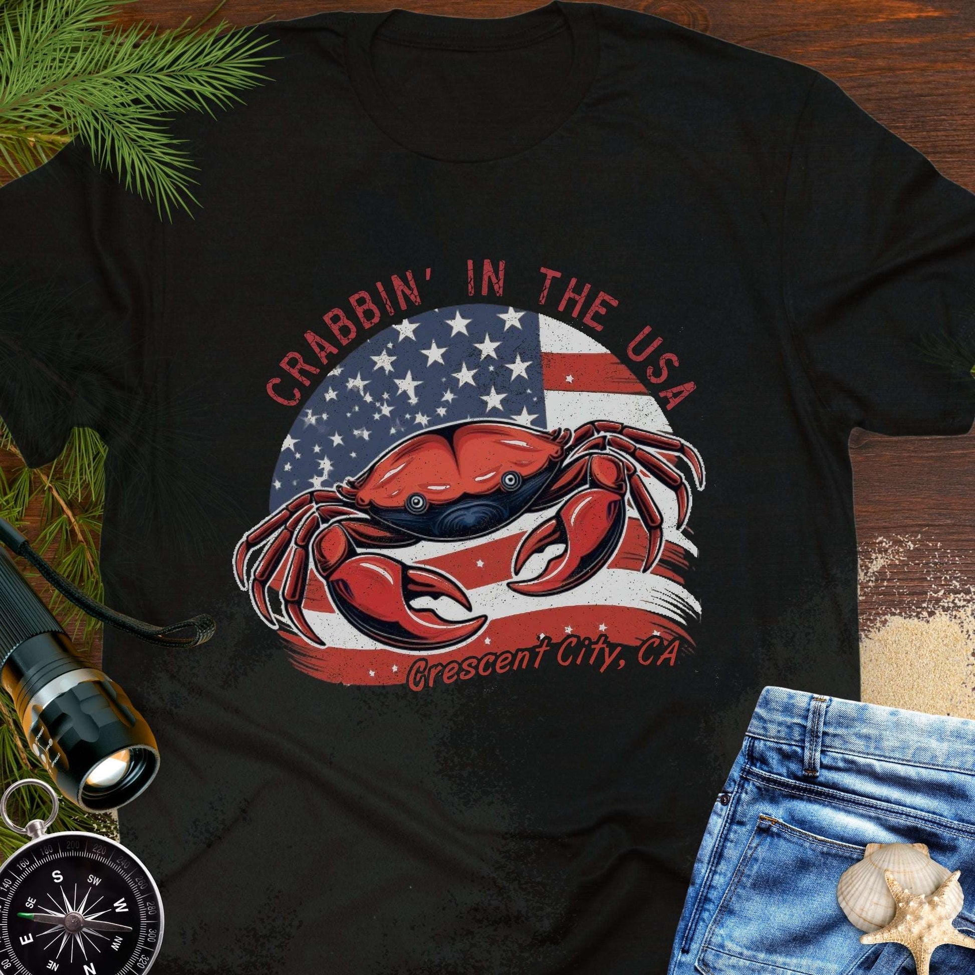 Black t-shirt with a crab and American flag design and text 'Crabbin' in the USA – Crescent City, CA'. 