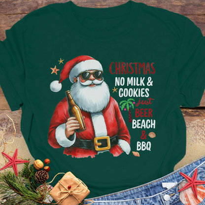 Green t-shirt with a graphic of Santa Claus holding a beer, text 'Christmas No Milk & Cookies Just Beer Beach & BBQ'.
