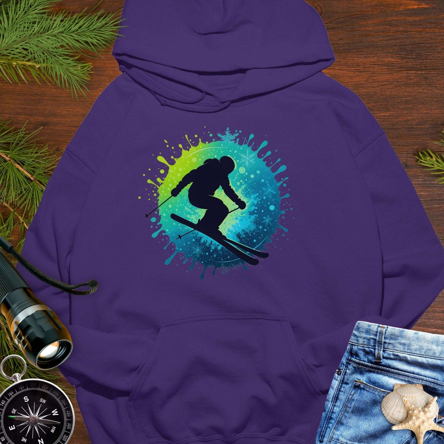 Purple hoodie with a colorful skiing graphic.