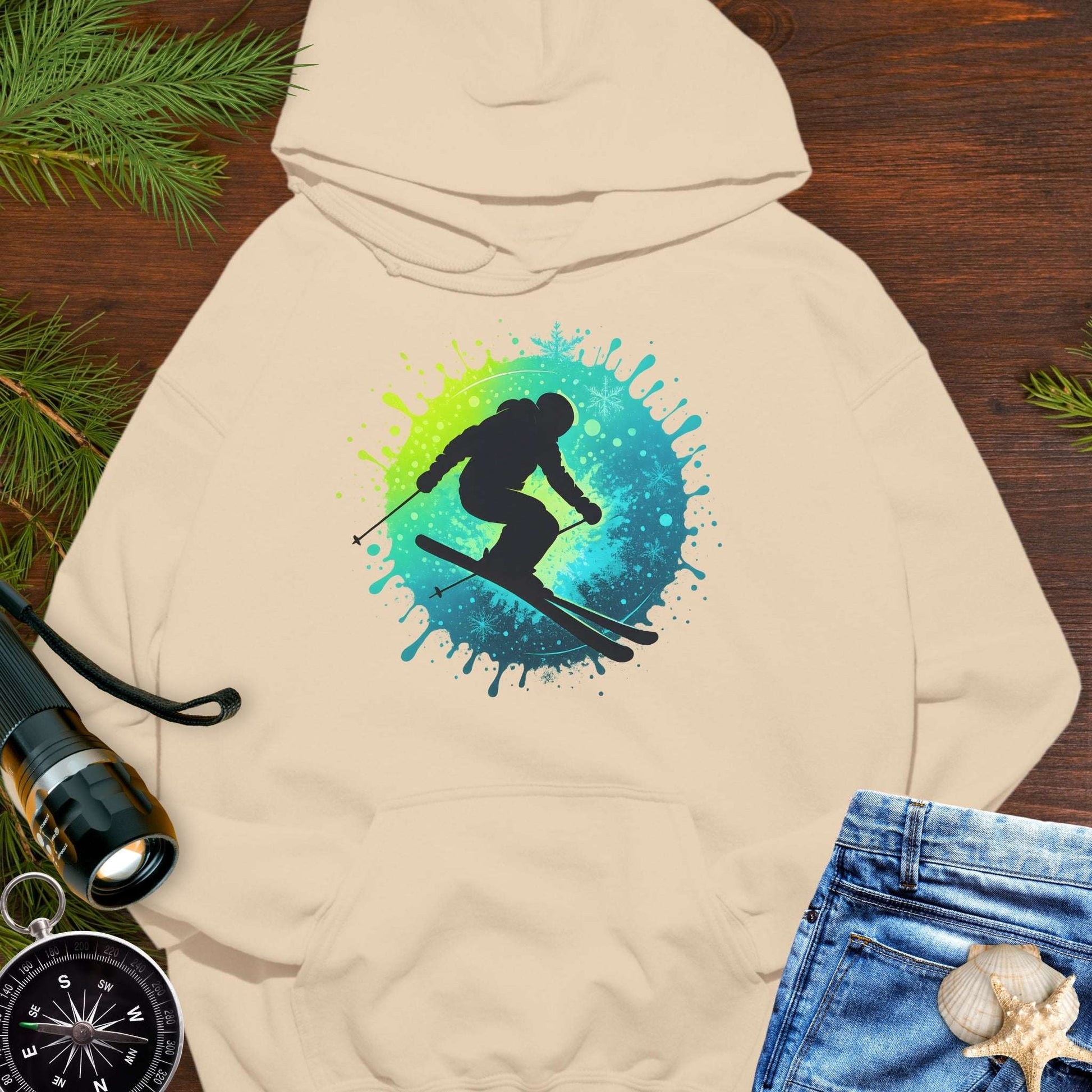 Beige hoodie with a colorful skiing graphic.