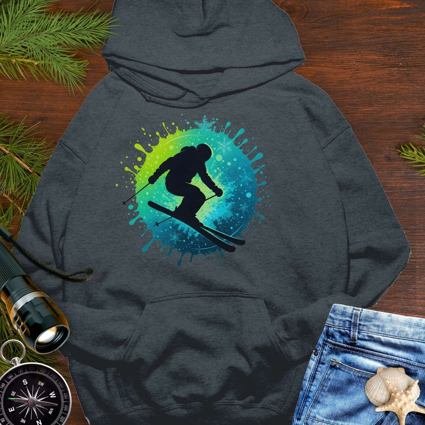 Gray hoodie with a colorful skiing graphic.