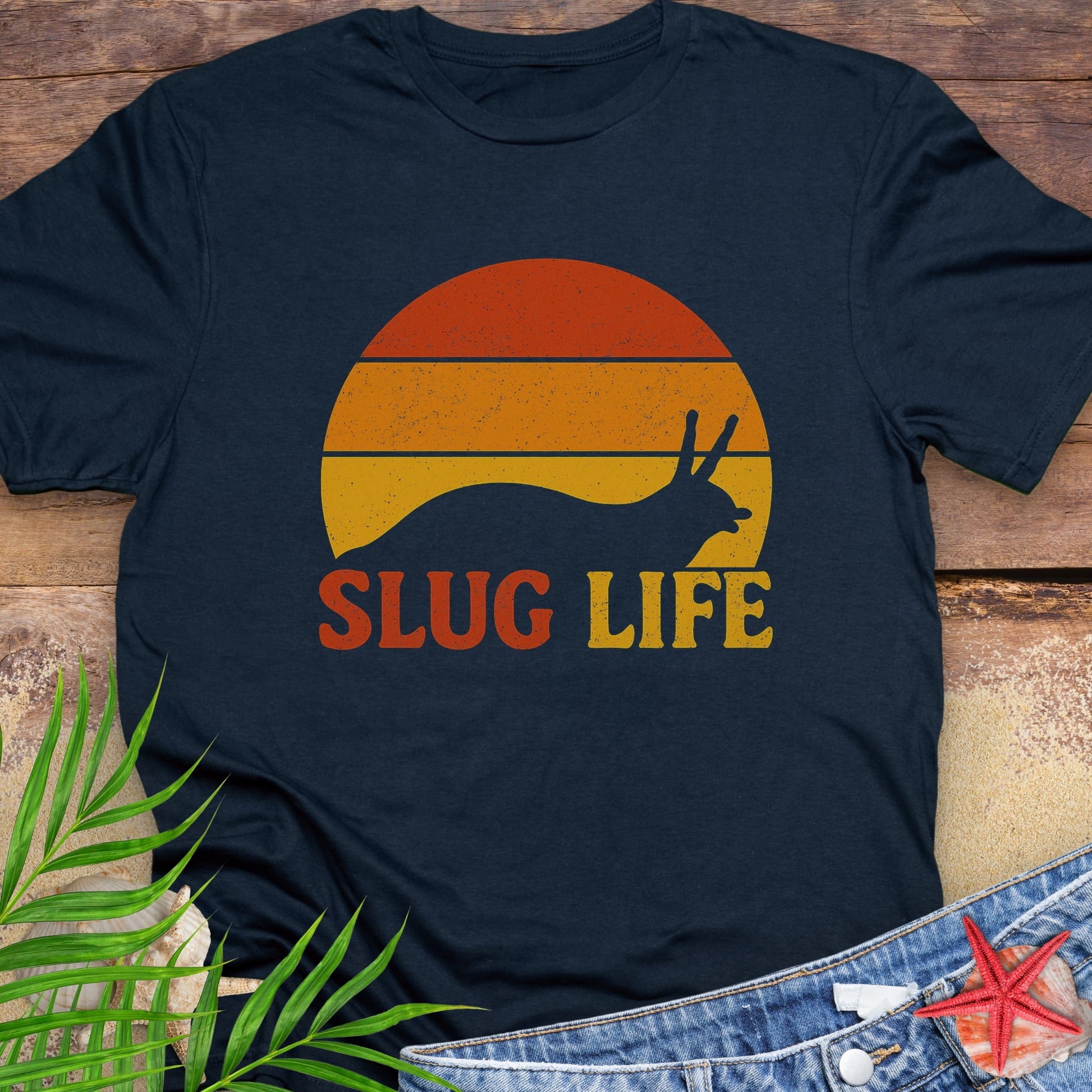 Navy t-shirt with 'Slug Life' sunset graphic.
