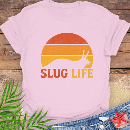 Pink t-shirt with 'Slug Life' sunset graphic.