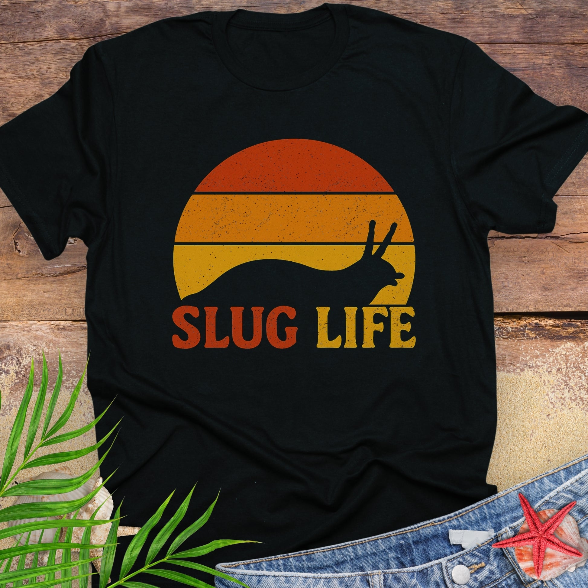 Black t-shirt with 'Slug Life' sunset graphic.