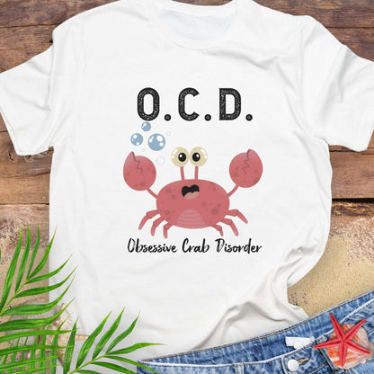 White t-shirt with a cartoon crab and text OCD Obsessive Crab Disorder.