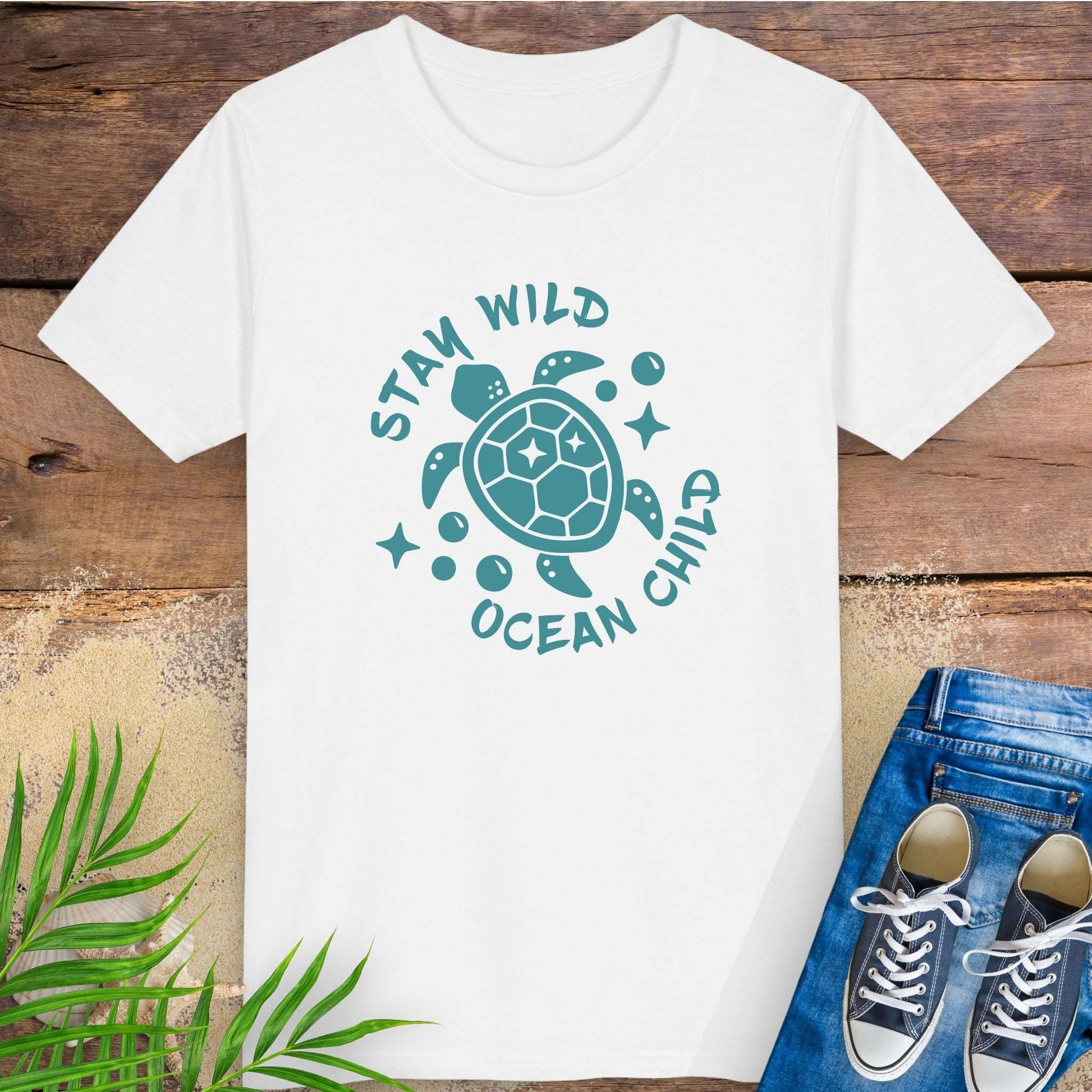 White t-shirt with sea turtle graphic and text stay wild ocean child.