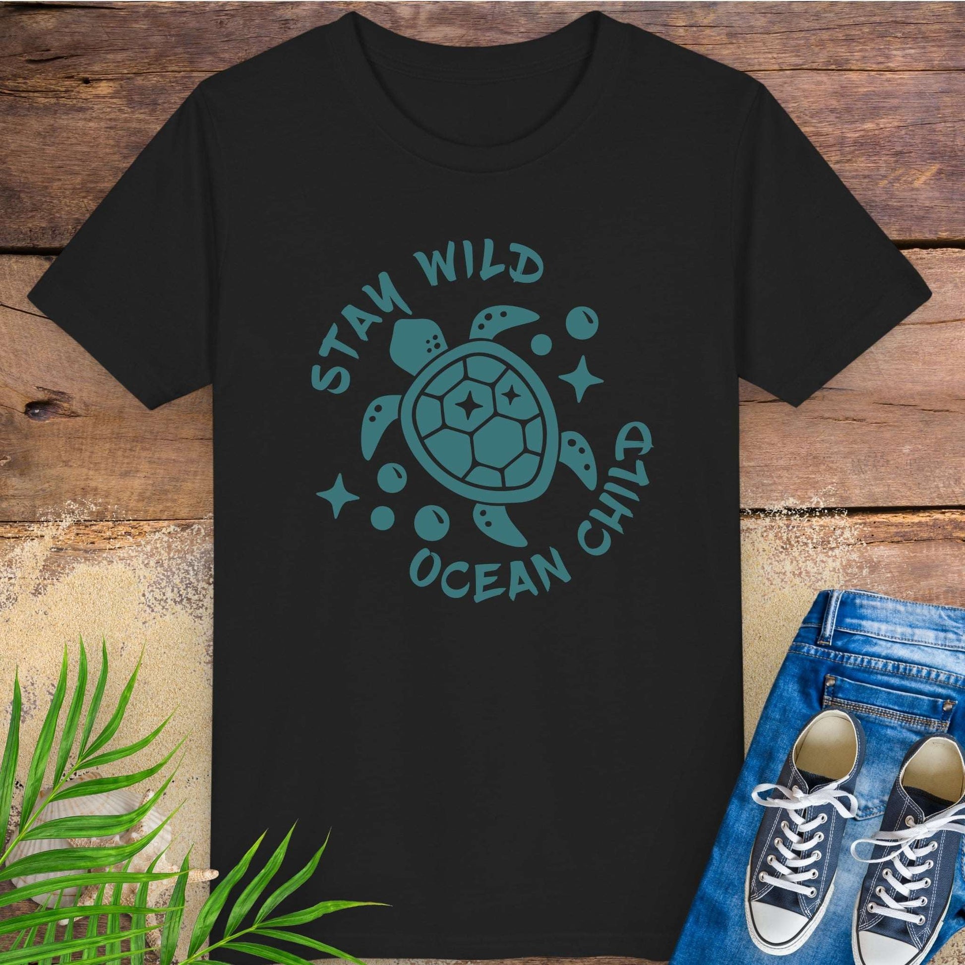 Black t-shirt with sea turtle graphic and text stay wild ocean child.