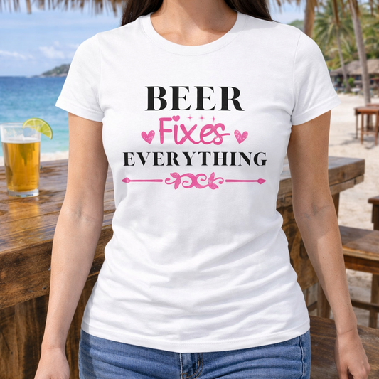 Person wearing a white women’s t-shirt with “Beer Fixes Everything” graphic text in black and pink, styled for beach or summer wear.