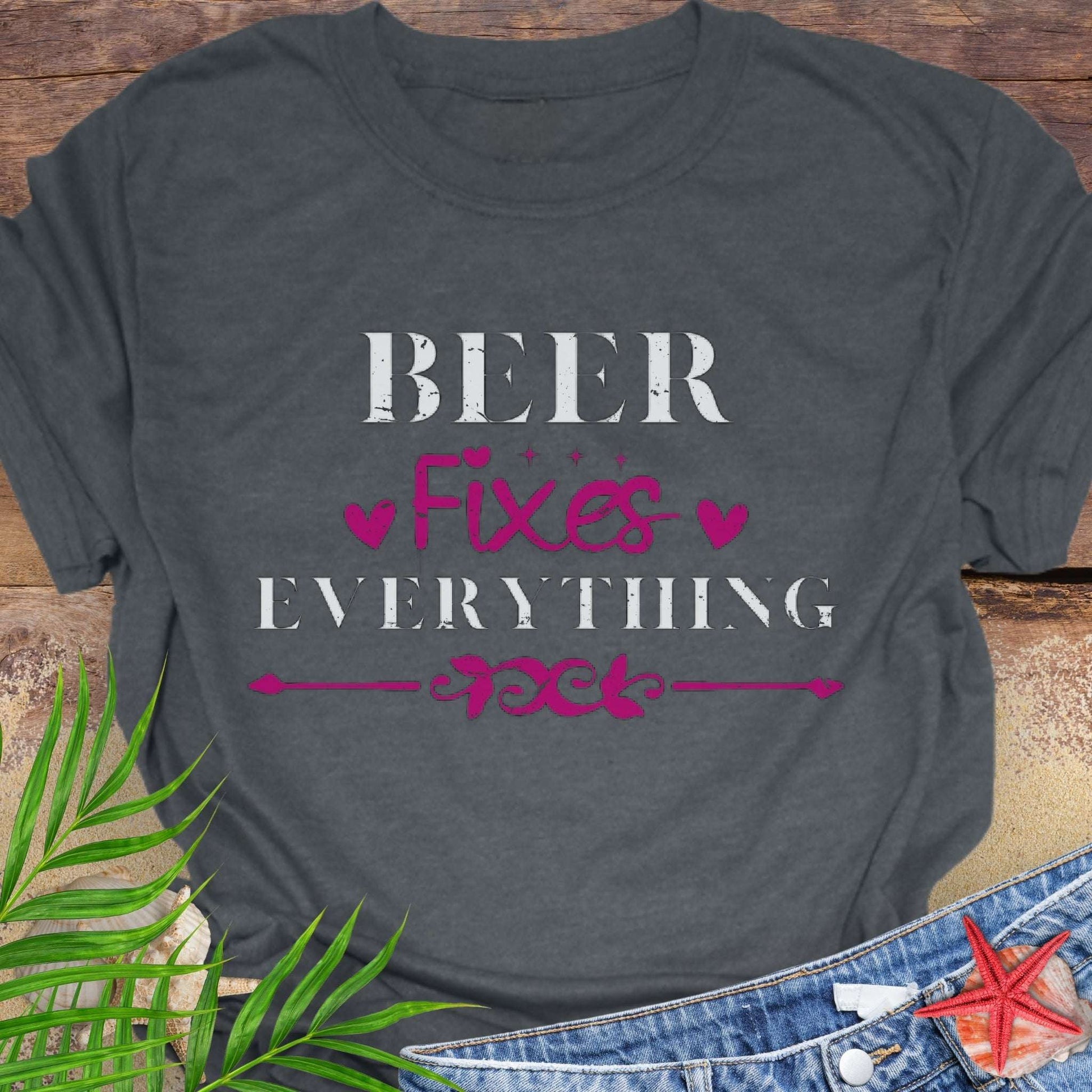 Gray unisex t-shirt with “Beer Fixes Everything” text and decorative pink hearts and scroll graphic.