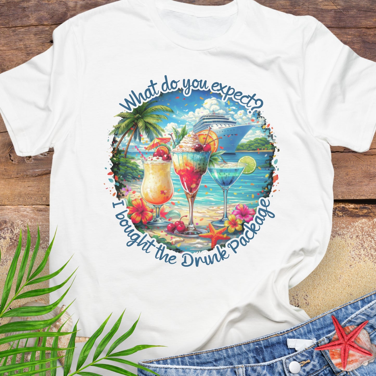 White unisex t-shirt with tropical cocktail and cruise ship graphic and text "What do you expect? I bought the drink package".