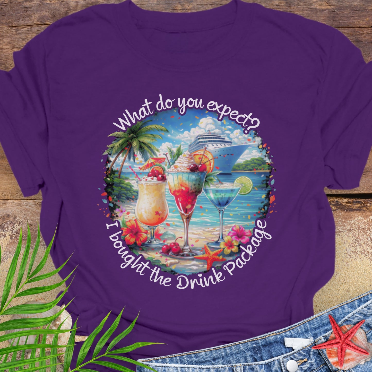 Purple unisex t-shirt with tropical cocktail and cruise ship graphic and text "What do you expect? I bought the drink package"