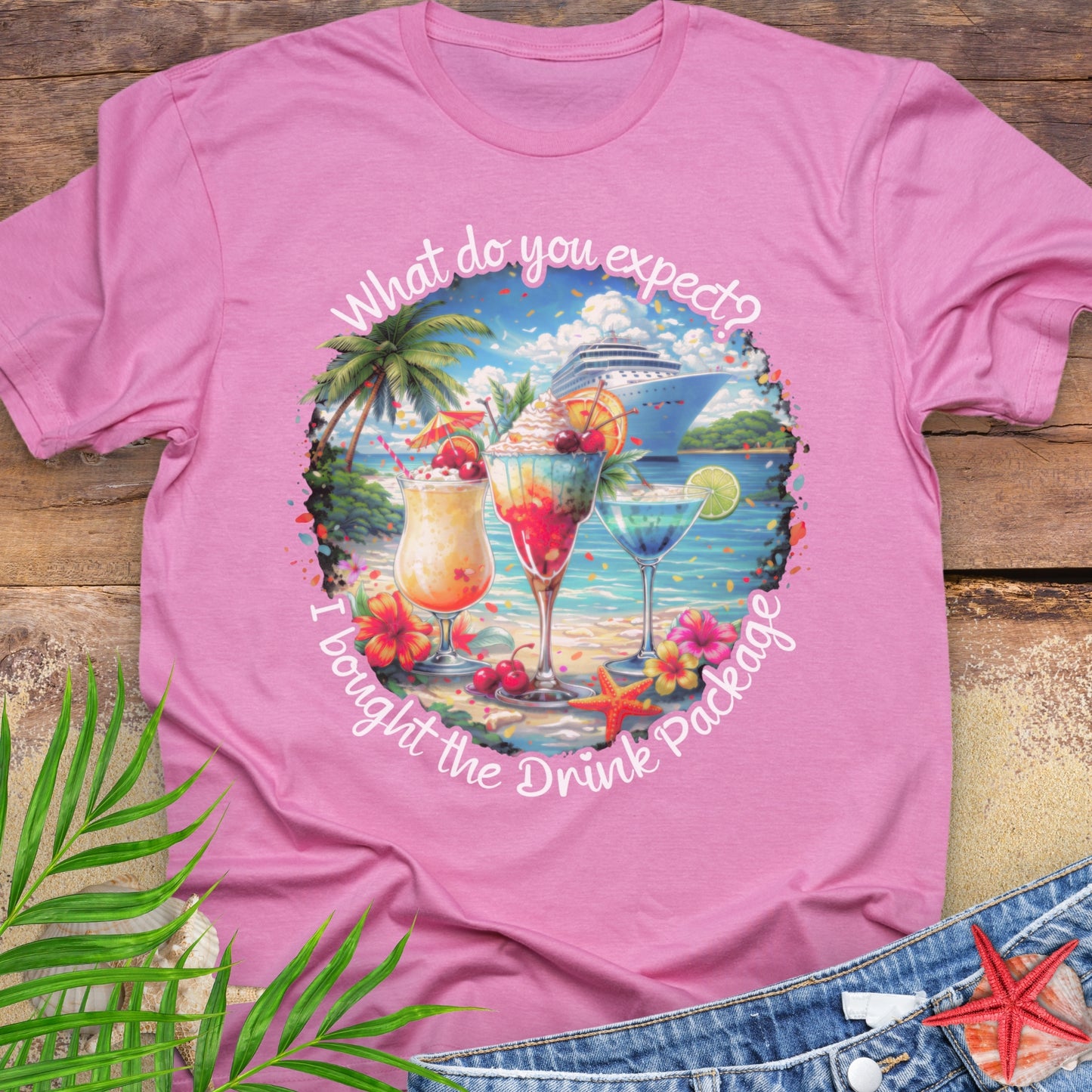 Azalea pink unisex t-shirt with tropical cocktail and cruise ship graphic and text "What do you expect? I bought the drink package"