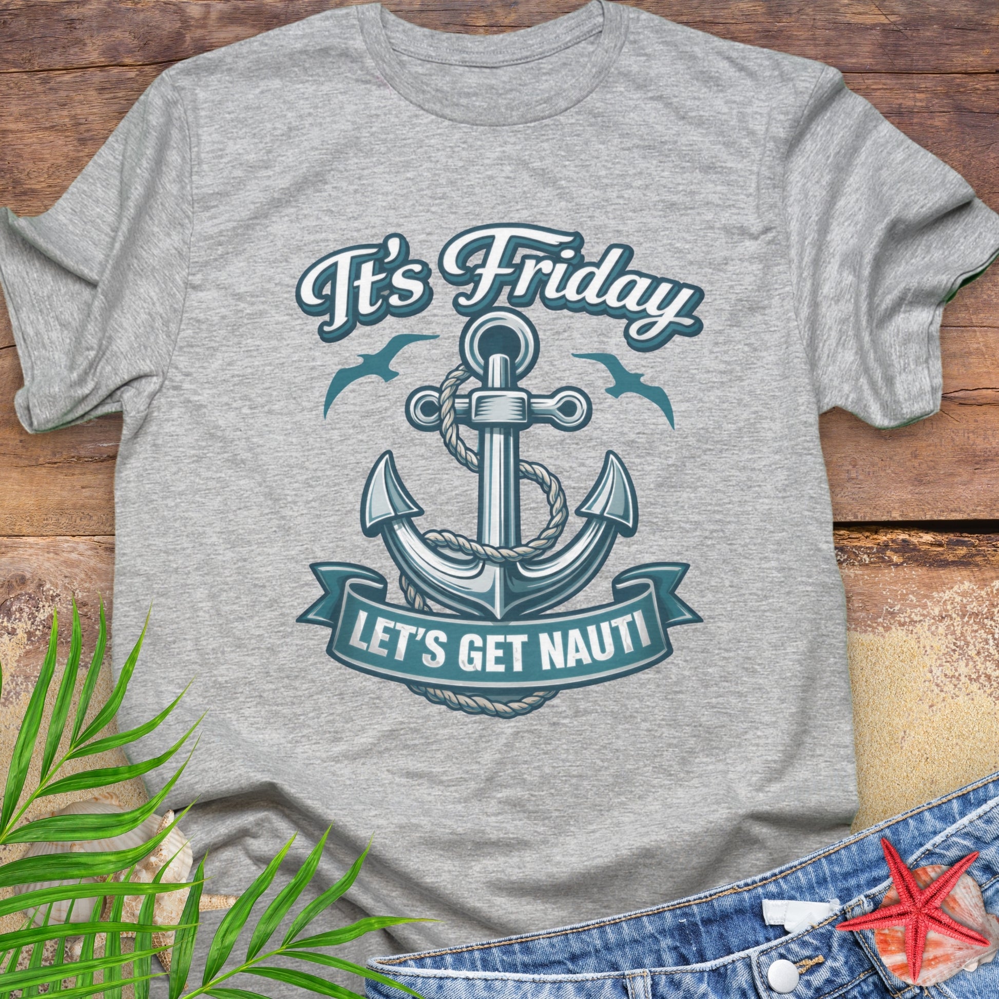 Gray unisex t-shirt with a nautical anchor design and text “It’s Friday Let’s Get Nauti”.