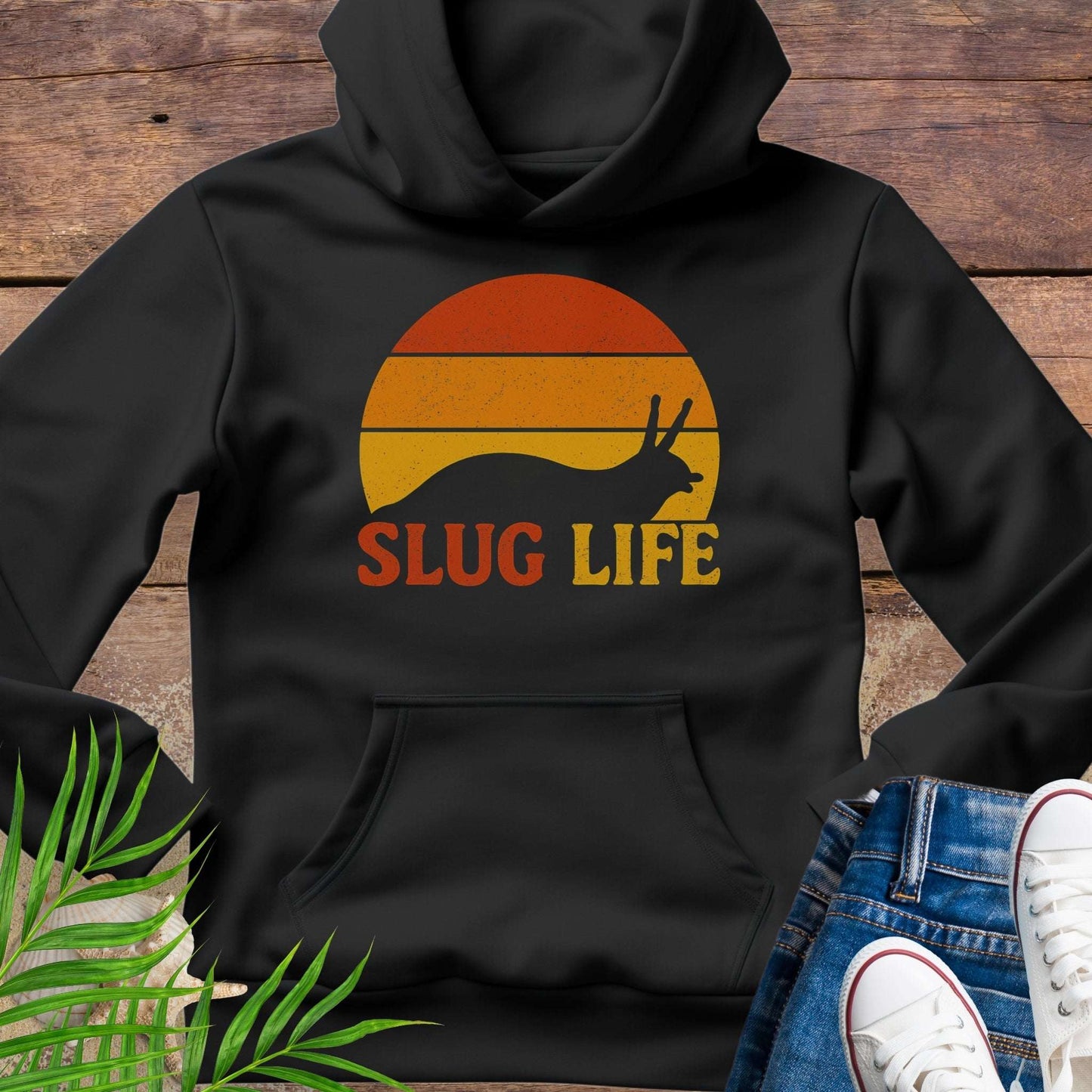 Black hoodie with 'SLUG LIFE' retro sunset design.