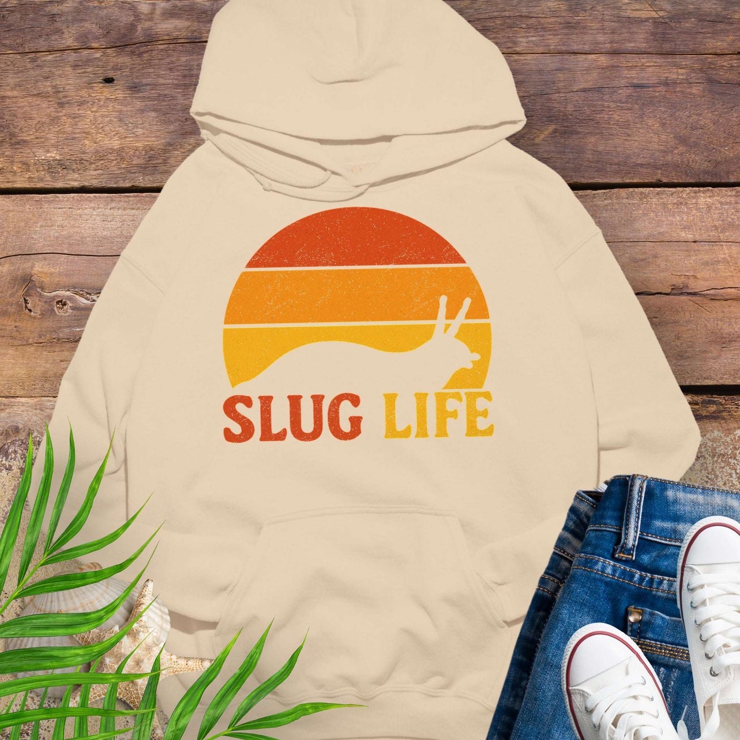Beige hoodie with 'SLUG LIFE' retro sunset design.