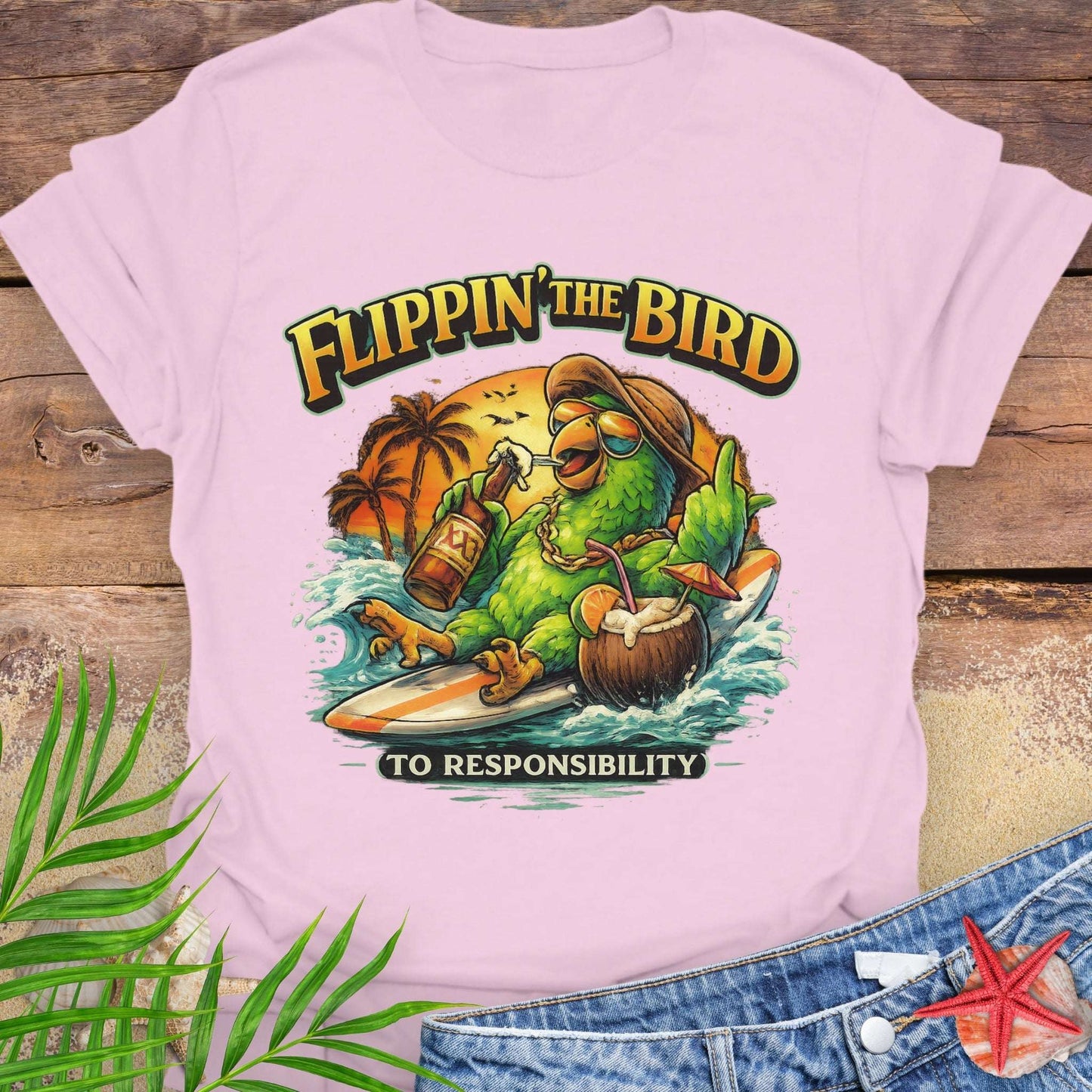 Pink Unisex t-shirt featuring a cartoon parrot relaxing on a surfboard with beer and coconut drink under a tropical sunset, with the phrase “Flippin’ the Bird to Responsibility”