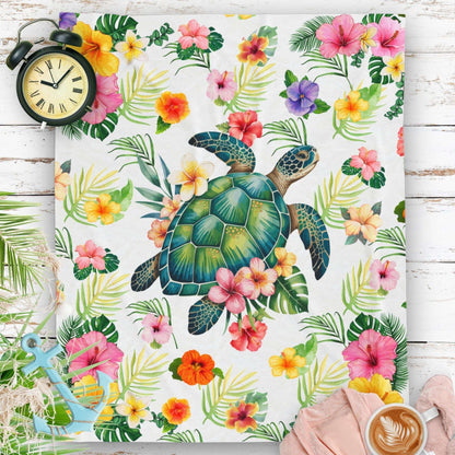 Cozy tropical velveteen throw blanket featuring a sea turtle surrounded by colorful hibiscus flowers and palm leaves, perfect for beachy home decor.