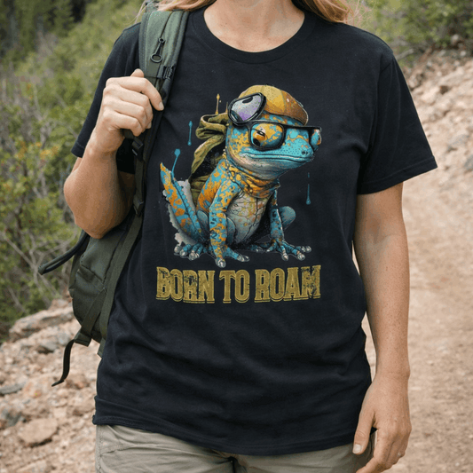 Woman hiking outdoors wearing a black t-shirt with a graphic of a Salamander and 'Born to Roam' text.
