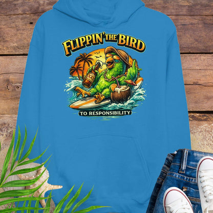 Turquoise tropical graphic hoodie featuring a green parrot surfing with sunglasses, holding a beer, with coconut drink and sunset palms; text reads “Flippin’ the Bird (to responsibility)”.