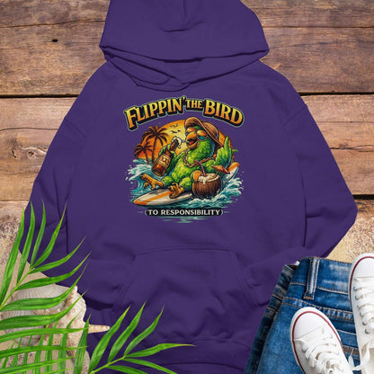 Purple tropical graphic hoodie featuring a green parrot surfing with sunglasses, holding a beer, with coconut drink and sunset palms; text reads “Flippin’ the Bird (to responsibility)”.