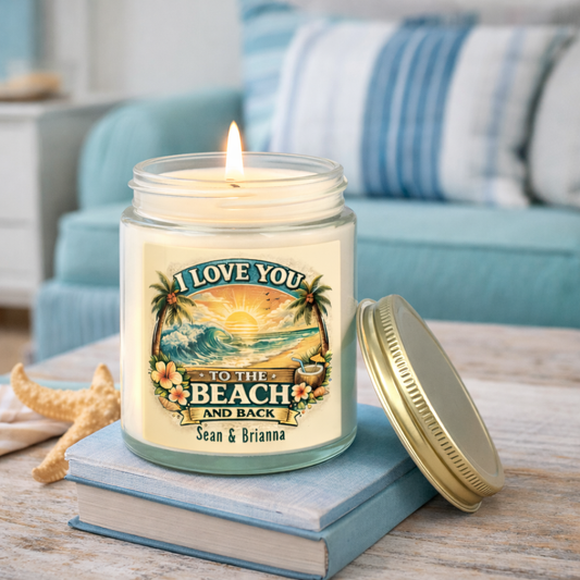 Candle in a jar with a beach-themed label on a table with a couch in the background