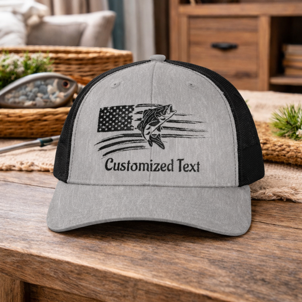 Gray and black cap with embroidered fish over the US Flag design and 'Customized Text'.