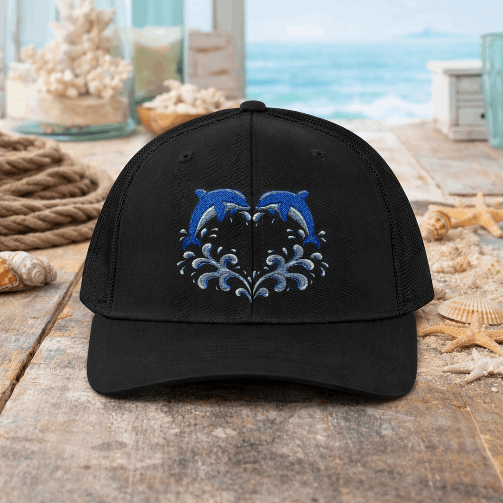 Black cap with two dolphins forming a heart embroidery design