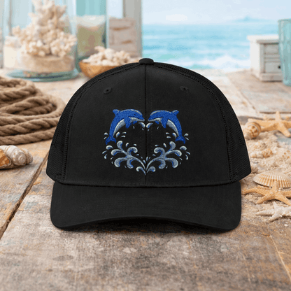 Black cap with two dolphins forming a heart embroidery design