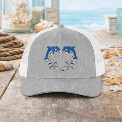 Gray and white cap with two dolphins forming a heart embroidery design