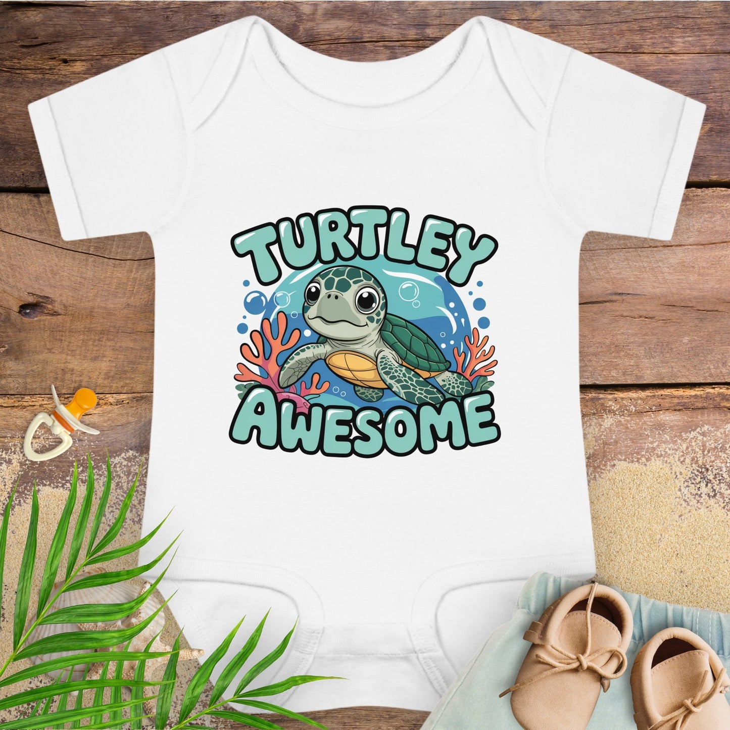 White baby onesie with a turtle graphic and 'Turtley Awesome' text on a wooden surface.