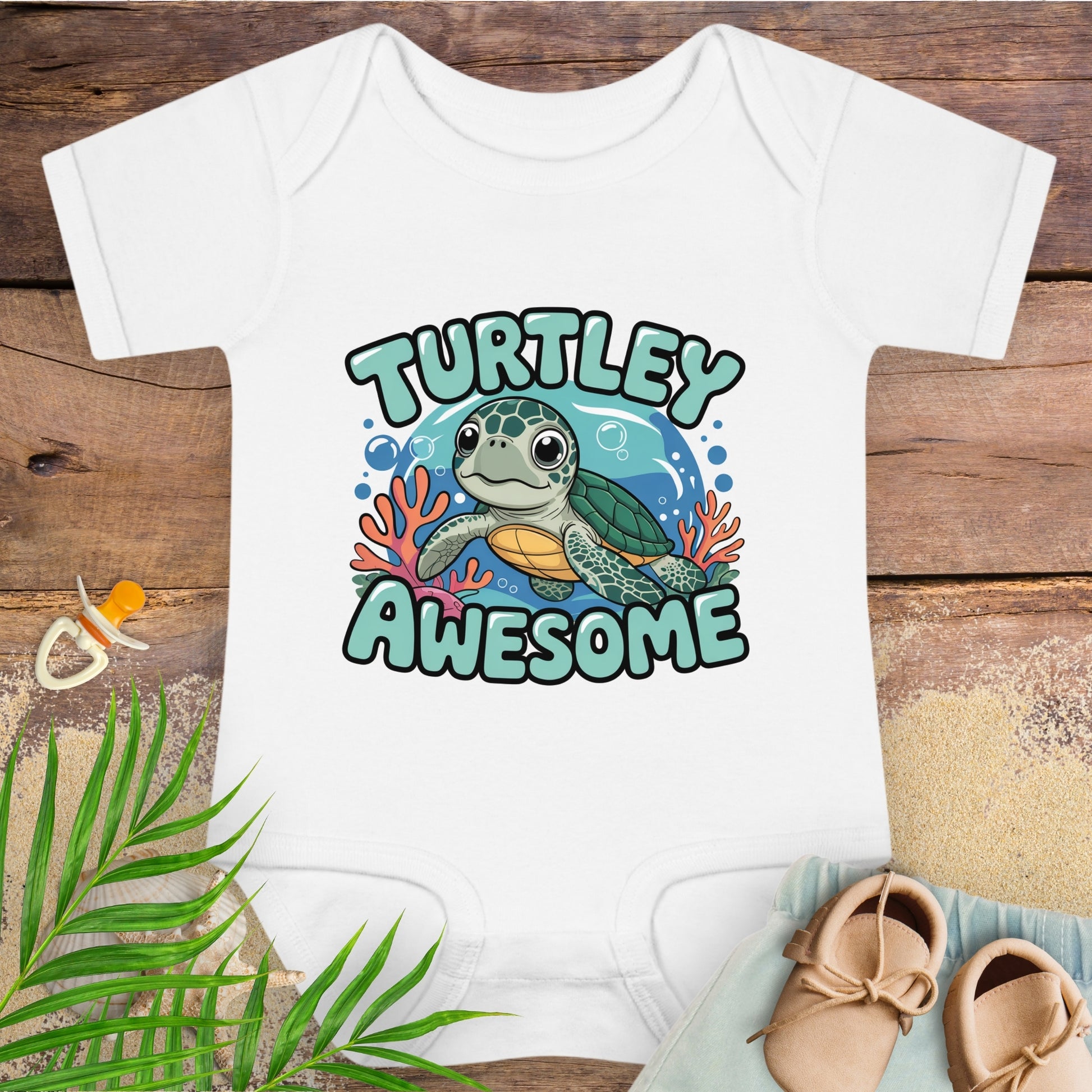 White baby onesie with a turtle graphic and 'Turtley Awesome' text on a wooden surface.