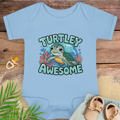 Light blue baby onesie with a turtle graphic and 'Turtley Awesome' text on a wooden surface.